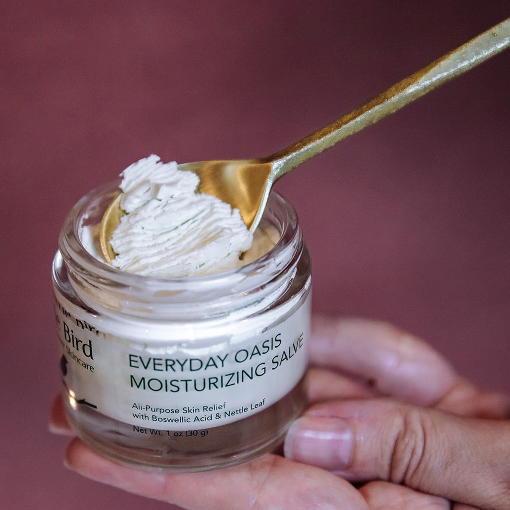 Everyday Oasis Moisturizing Salve with spoon showing product texture